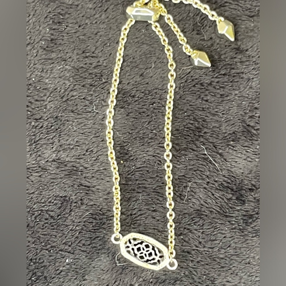 NWOT. Kendra Scott black mesh and gold bracelet. Dust bag included.